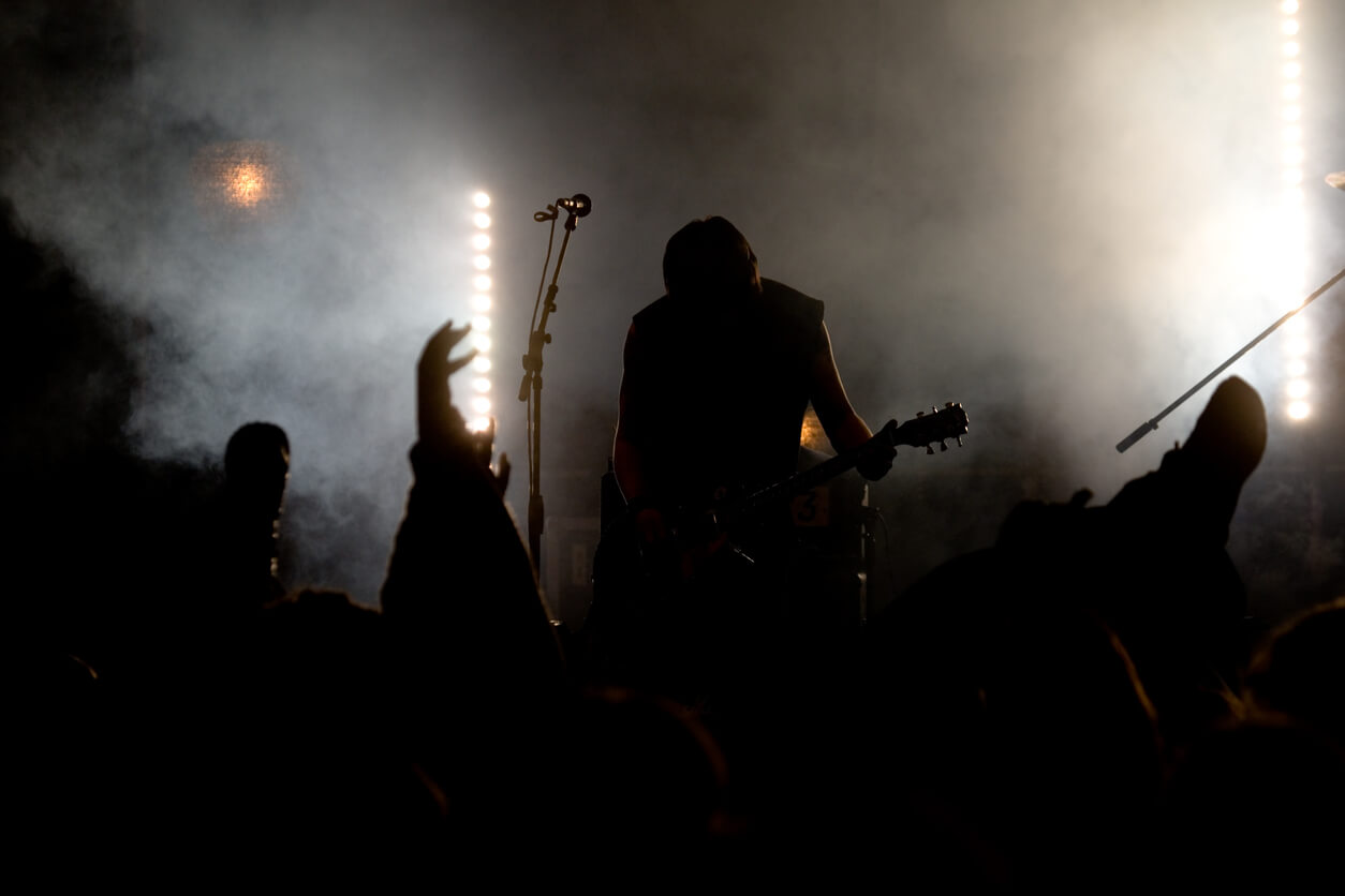 Dark Moody Image Showing Musician in a Band Performing Live