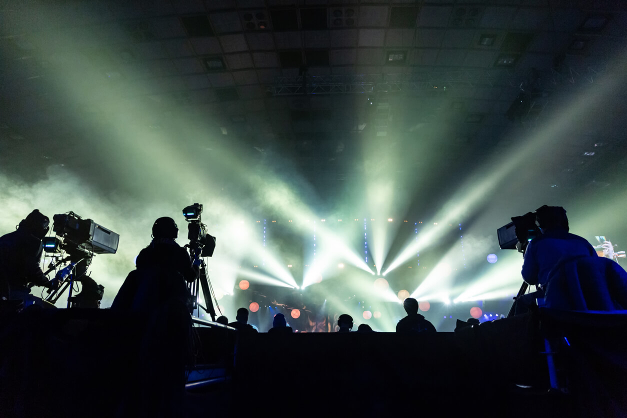 Camera Crew Recording Live Performance Footage at an Event