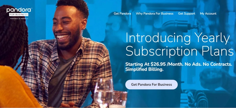 A promotional image for Pandora for Business featuring a smiling man in a casual setting, with text overlay advertising the introduction of yearly subscription plans starting at $26.95 per month. The image highlights benefits like no ads, no contracts, and simplified billing, alongside a call-to-action button labeled "Get Pandora For Business."