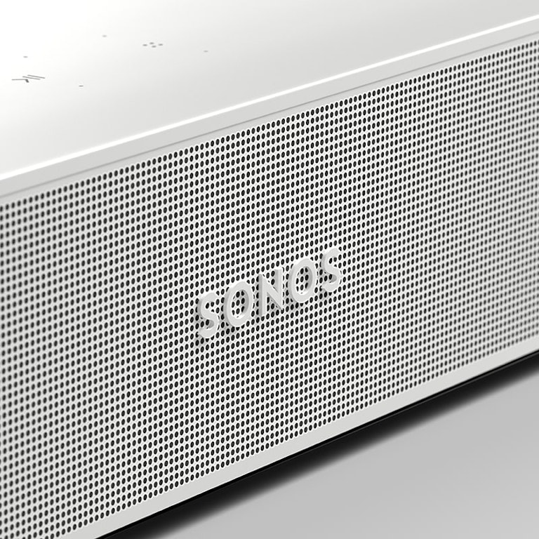 Close-up of a white Sonos speaker with a perforated mesh design.